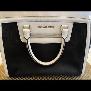 Simple black, white and gold Michael Kors handbag.